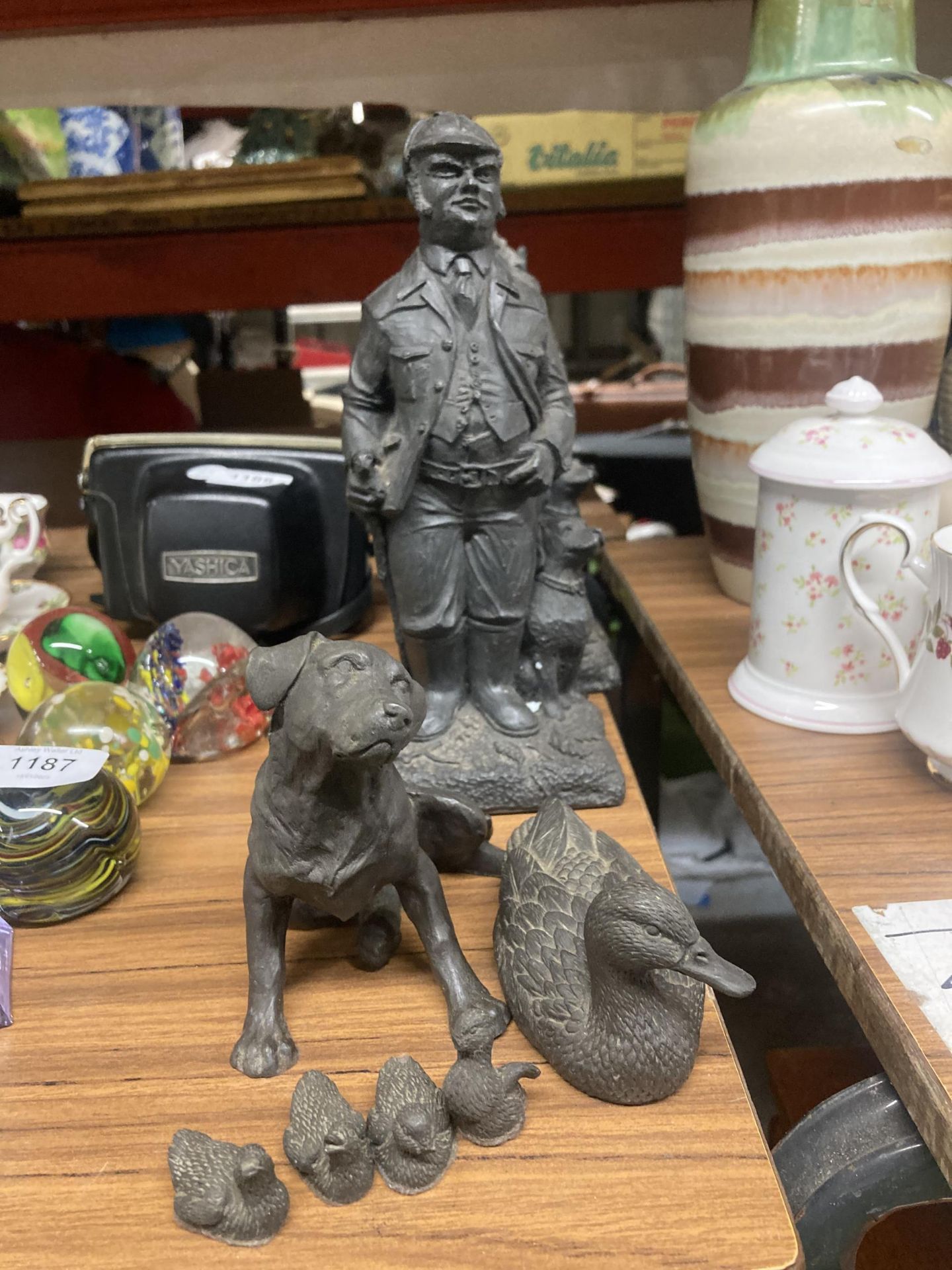 THREE PLASTER COAL GAMEKEEPER FIGURES TOGETHER WITH DOG FIGURE AND DUCKS