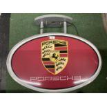 A LARGE ILLUMINATED 'PORSCHE' CAR SIGN, 57 X 70 X 17CM , AS NEW AND WORKING AT TIME OF CATALOGUING