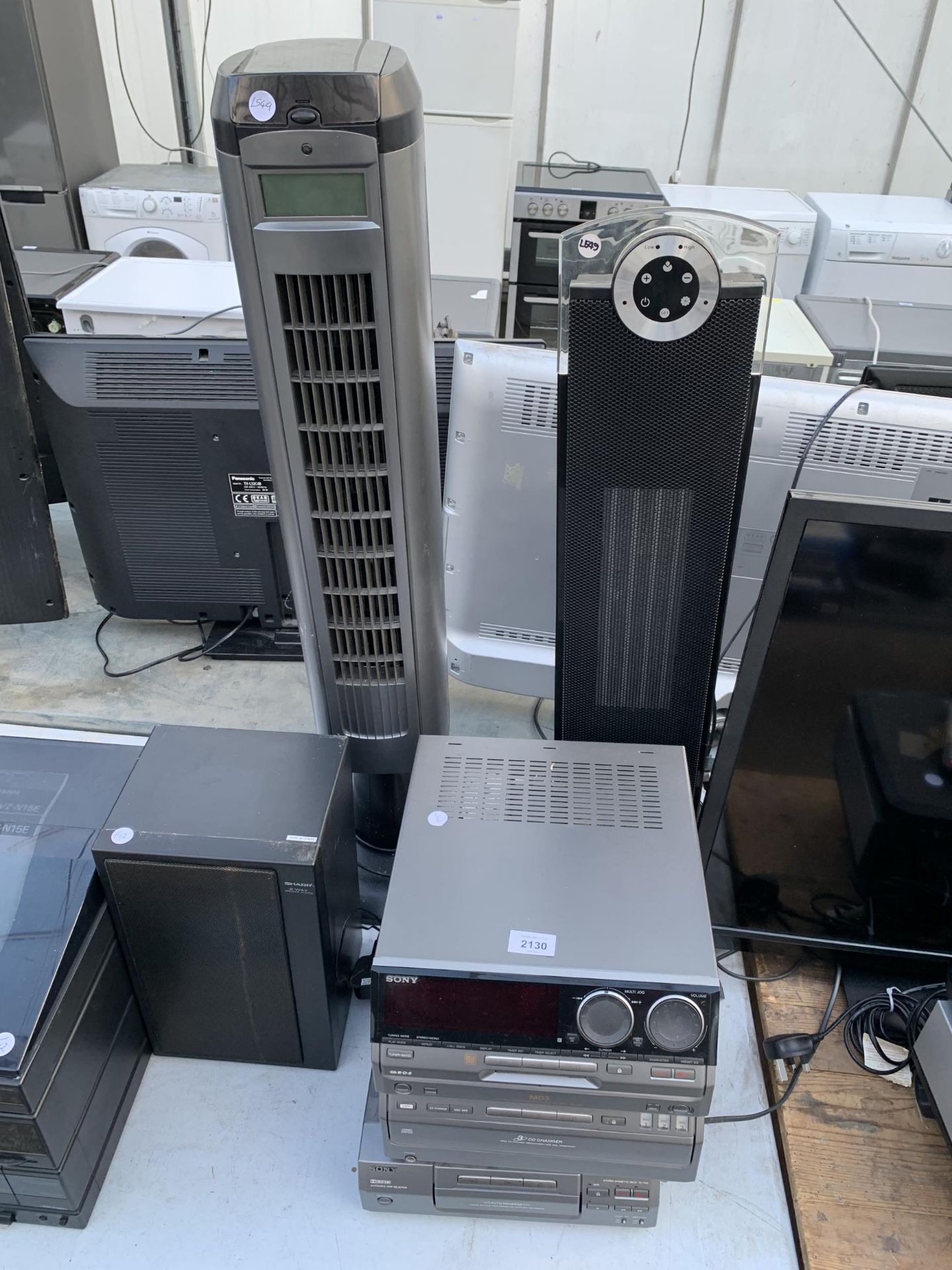 A SONY STEREO SYSTEM, A DIMPLEX HEATER AND A TOWER FAN