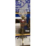 A LARGE VICTORIAN OIL LAMP WITH CRANBERRY RESEVOIR AND ETCHED GLASS SHADE ON TWISTED EFFECT BRASS