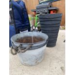 A PLASTIC PLANTER AND THREE TIN PLANTERS