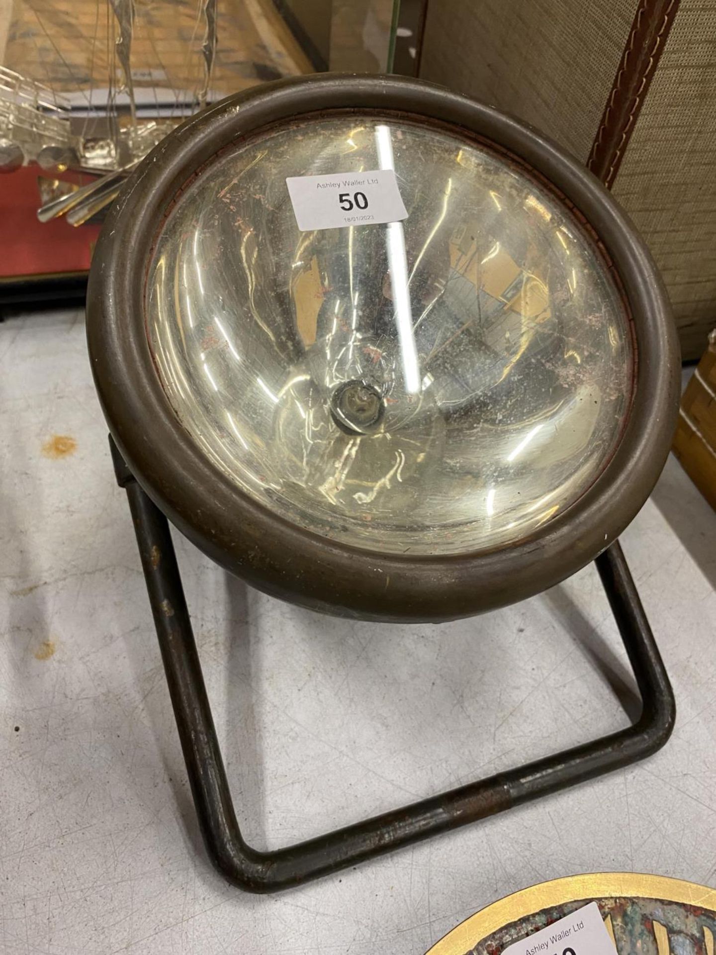 A VINTAGE RAILWAY LAMP ON STAND