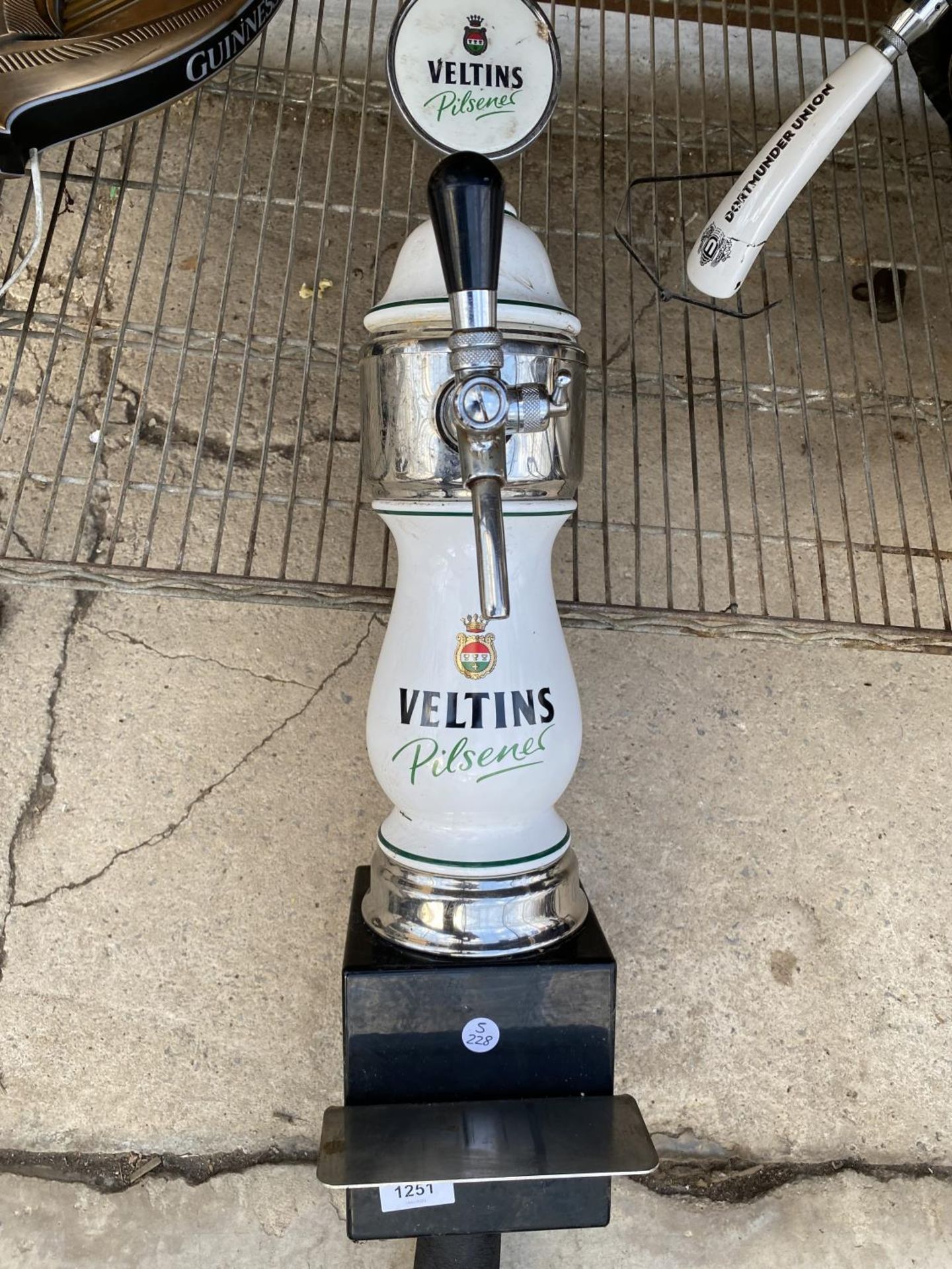 A CERAMIC 'VELTINS PILSNER' BEER PUMP