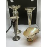 A GROUP OF FOUR HALLMARKED SILVER ITEMS COMPRISING THREE SILVER WEIGHTED BASE POSY VASES AND A SMALL