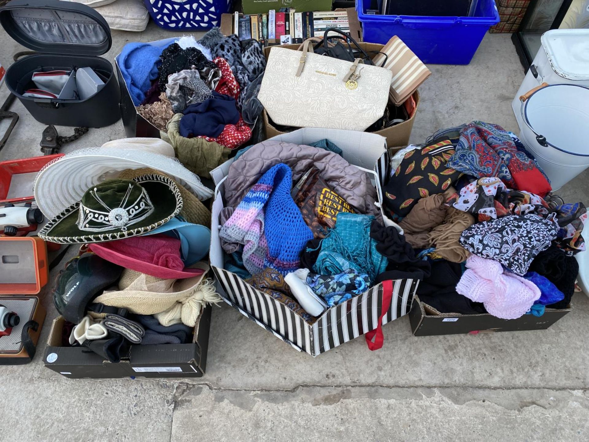 A LARGE ASSORTMENT OF CLOTHES, HANDBAGS AND SCARVES ETC