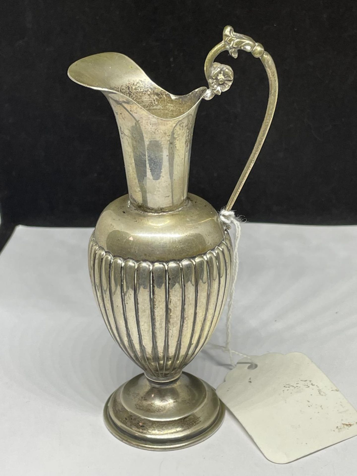 A MARKED SILVER JUG GROSS WEIGHT 75.4 GRAMS