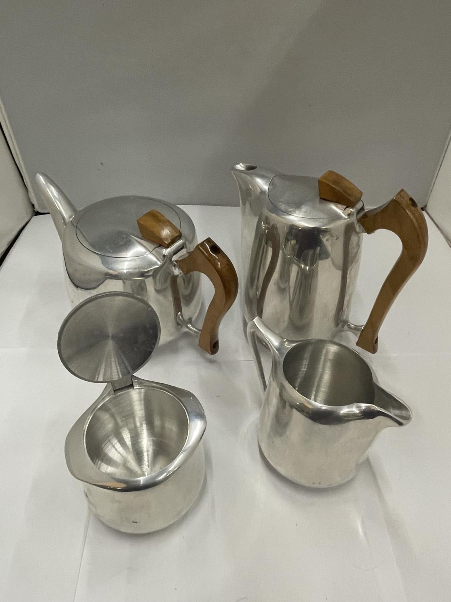 A PICQUOT WARE STAINLESS STEEL TEAPOT, COFFEE POT, SUGAR BOWL AND CREAM JUG - Image 2 of 4