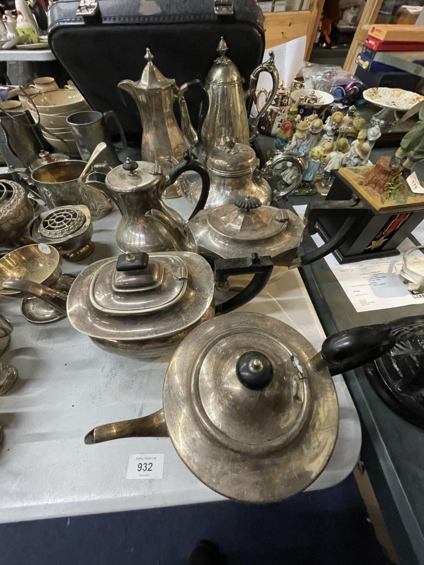A LARGE QUANTITY OF SILVER PLATED TEAPOTS AND COFFEE POTS