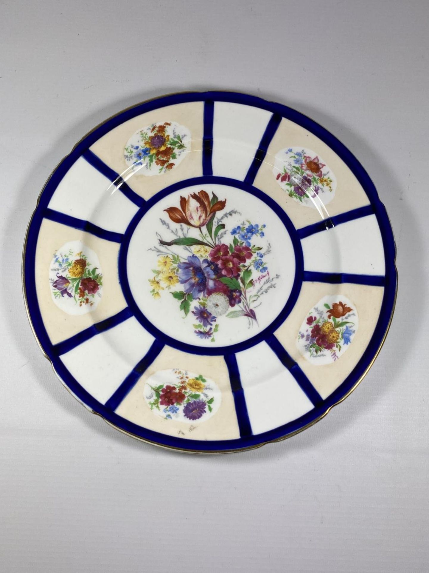 A HAND PAINTED FLORAL CABINET PLATE, SIGNED A.HOLLAND