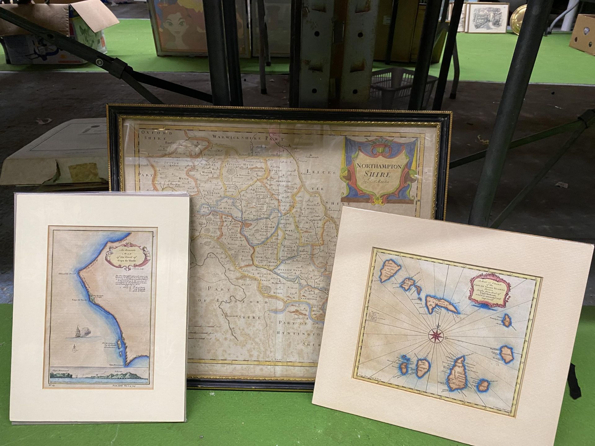 A FRAMED VINTAGE MAP OF NORTHAMPTONSHIRE PLUS TWO MOUNTED UNFRAMED MAPS OF CAPE DE VERDE