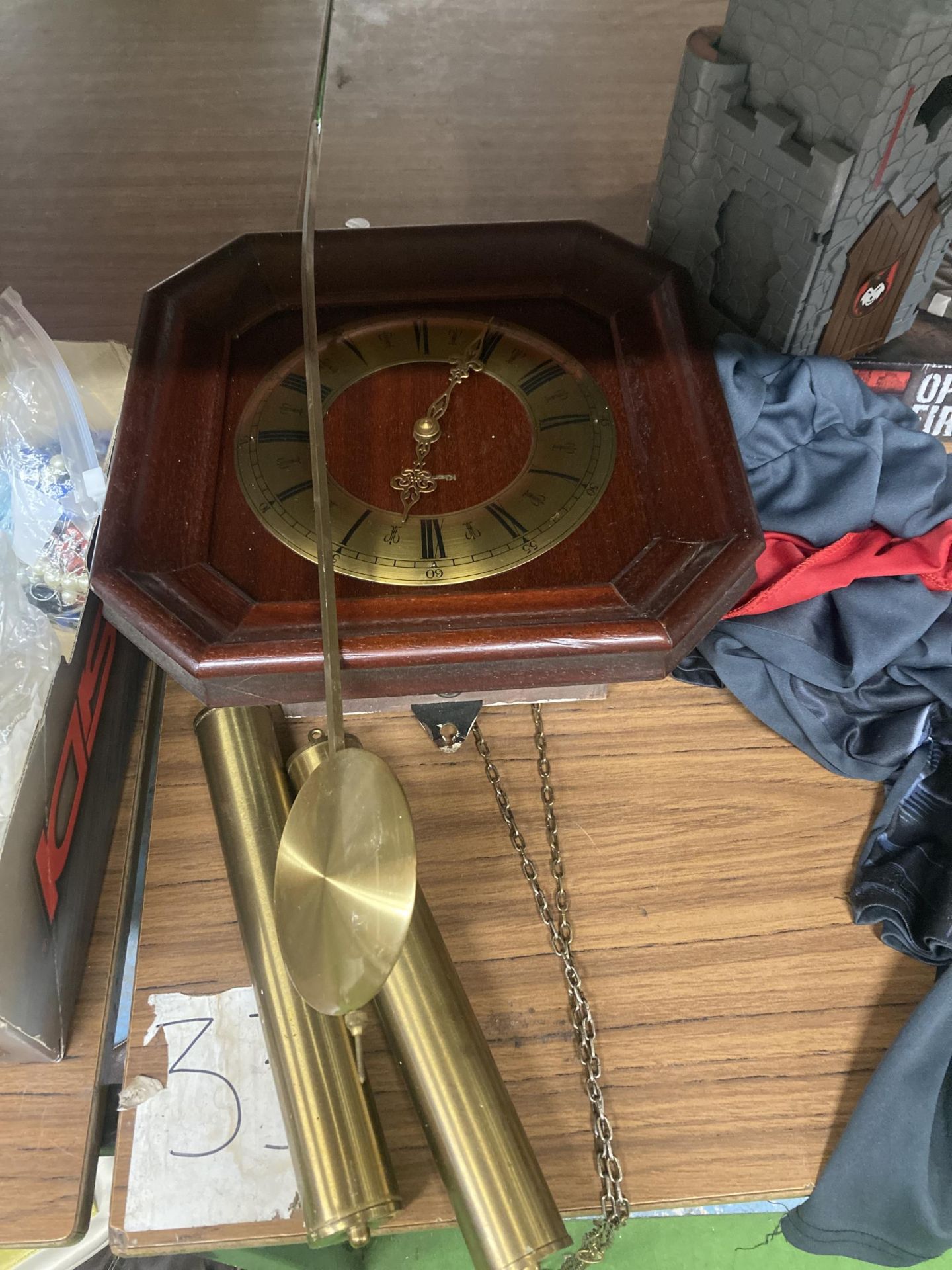 A MAHOGANY CASED WALL CLOCK WITH PENDULUM AND WEIGHTS