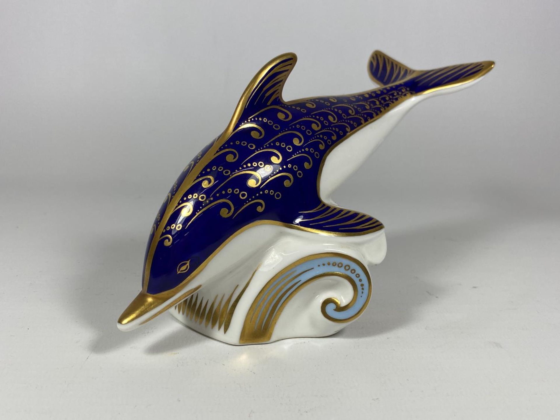 A ROYAL CROWN DERBY DOLPHIN PAPERWEIGHT, SILVER STOPPER