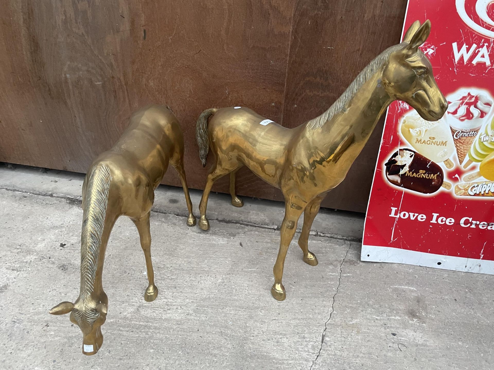 A PAIR OF LARGE HEAVY BRASS HORSES