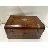 A WALNUT DOMED BOX WITH MOTHER OF PEARL INLAY AND PRESENTATION PLAQUE