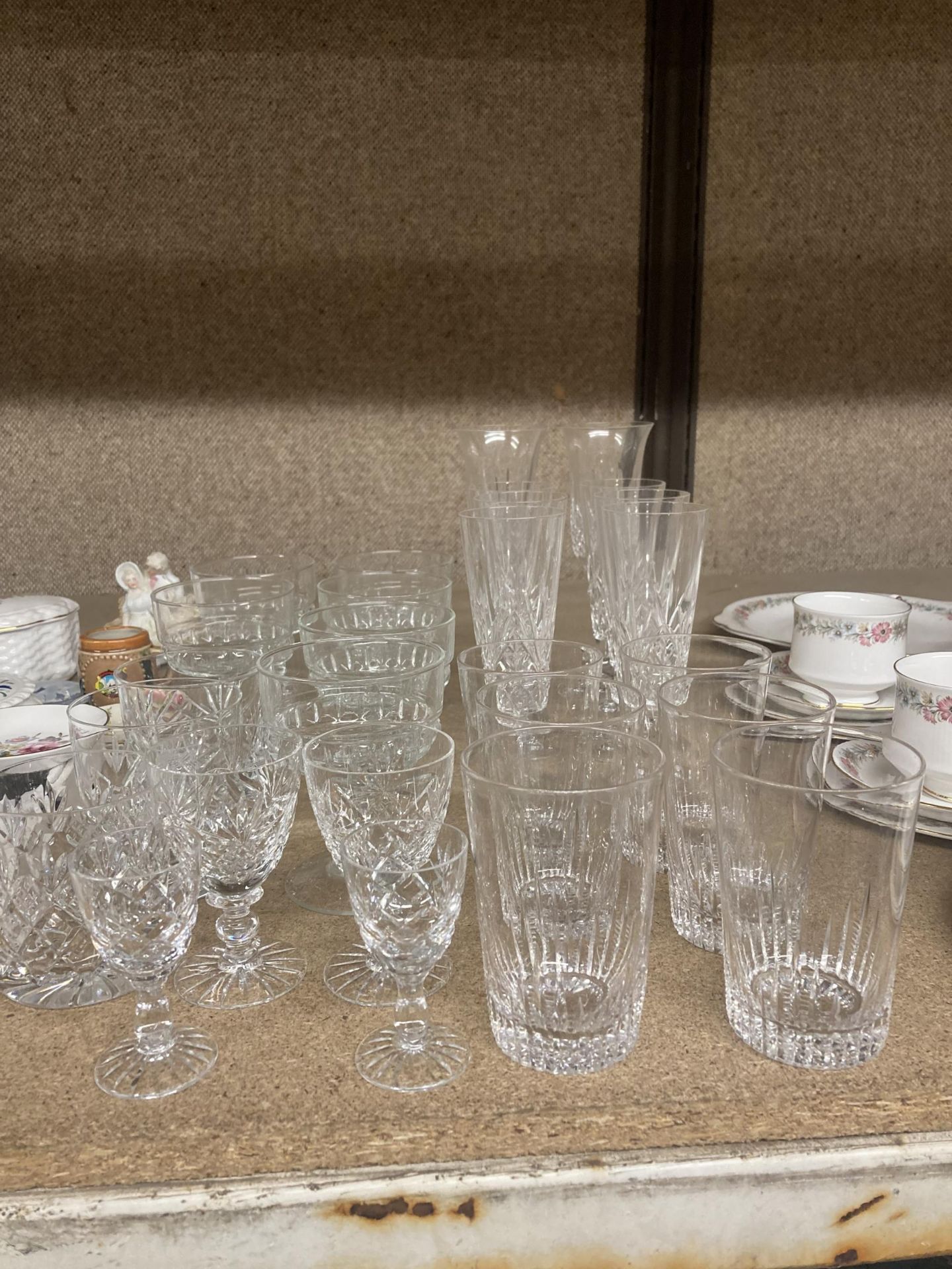 A QUANTITY OF GLASSWARE TO INCLUDE TUMBLERS, WINE GLASSES, SHERRY GLASSES, ETC.,