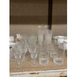 A QUANTITY OF GLASSWARE TO INCLUDE TUMBLERS, WINE GLASSES, SHERRY GLASSES, ETC.,