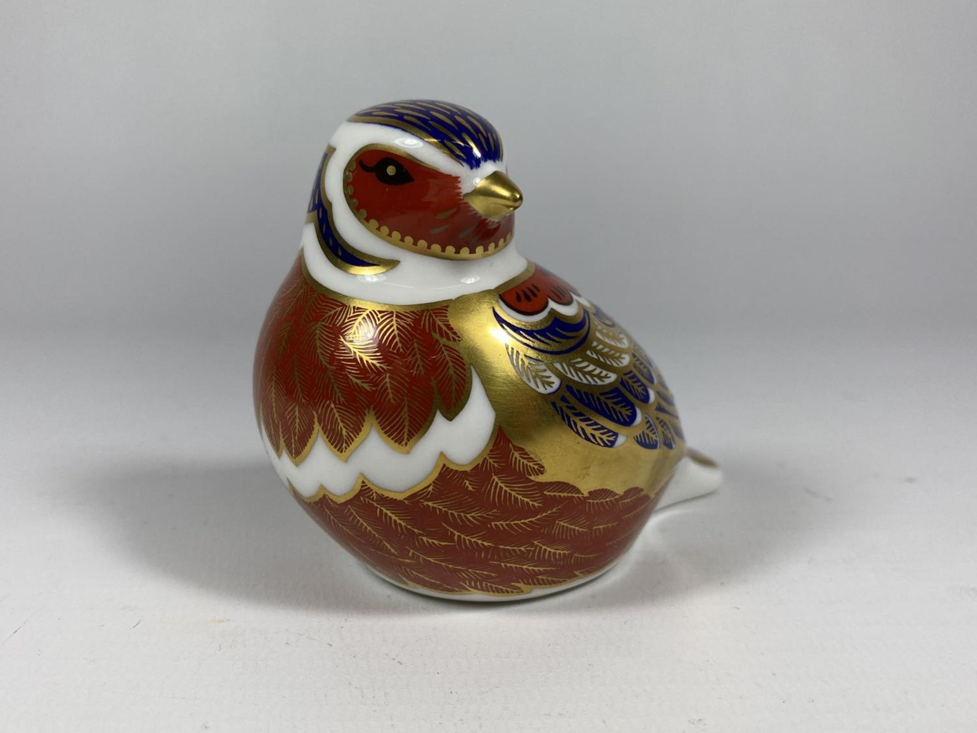 A ROYAL CROWN DERBY CHAFFINCH PAPERWEIGHT, SILVER STOPPER
