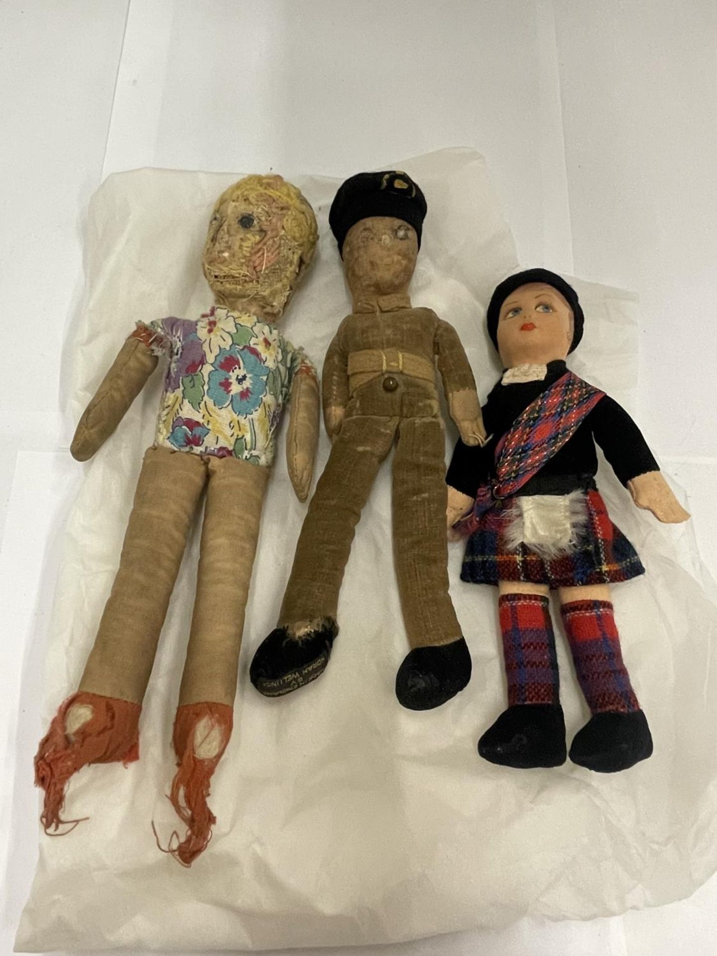 TWO VINTAGE NORAH WELLINGS DOLLS - A SCOTTISHMAN AND A SOLDIER WITH LABEL TO FEET PLUS ANOTHER NORAH