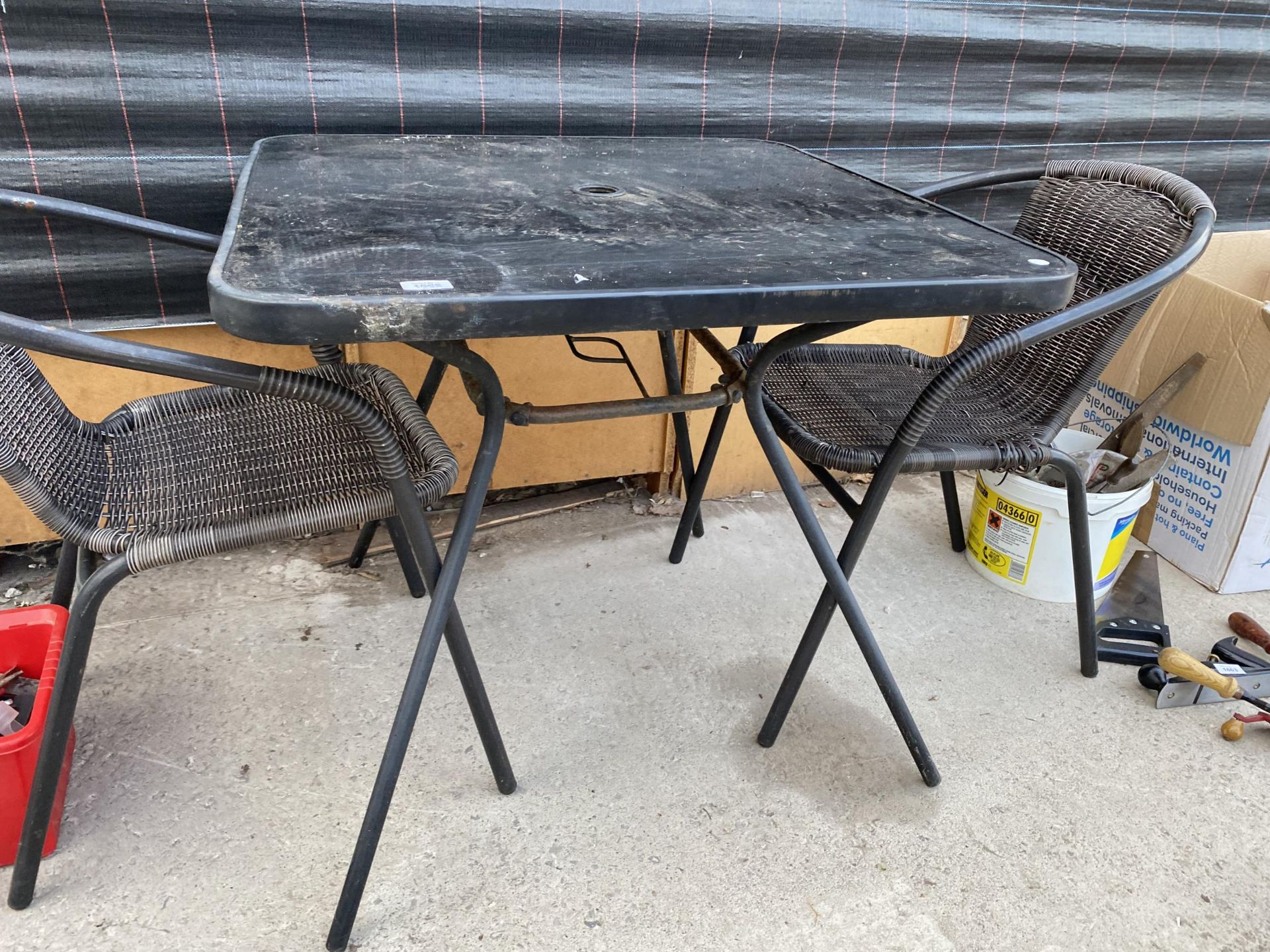 A SQUARE GLASS TOPPED BISTRO TABLE WITH TWO RATTAN STYLE CHAIRS - Bild 2 aus 3
