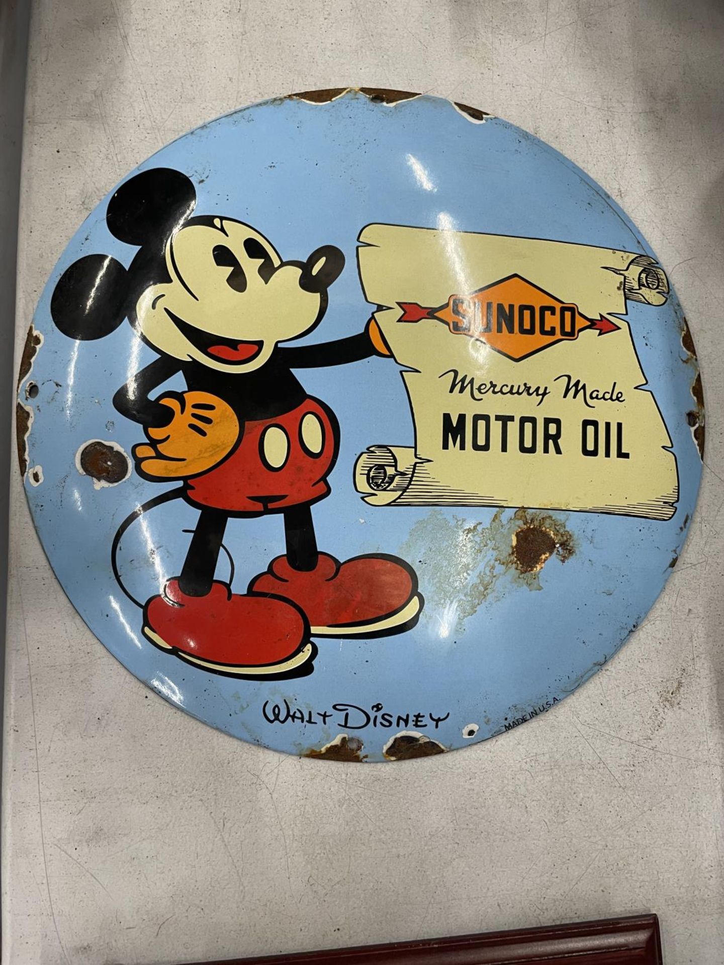 AN ENAMEL SIGN "SUNOCO MOTOR OIL" WALT DISNEY