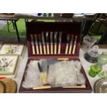 A VINTAGE MAHOGANY BOXED CANTEEN OF CUTLERY