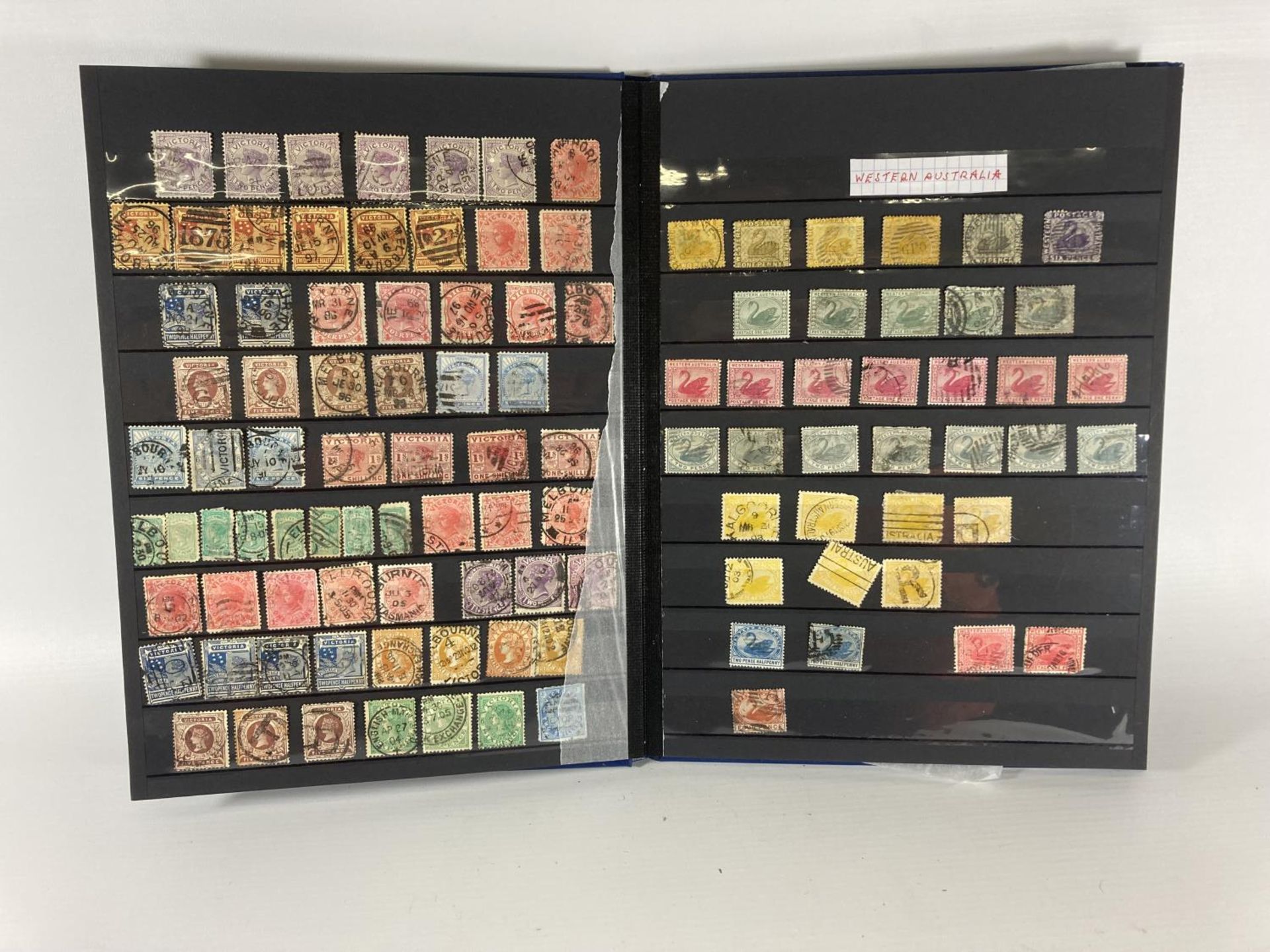 AN AUSTRALIAN VICTORIAN STATES STAMPS IN BLUE ALBUM