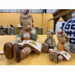 THREE GOEBEL HUMMEL FIGURES TO INCLUDE A LARGE MODEL OF A GIRL READING A BOOK, NO.620, HEIGHT 25CM