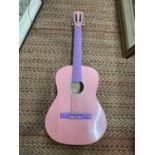 A PINK ACOUSTIC GUITAR