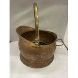 A VINTAGE COPPER COAL SCUTTLE