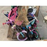 A LARGE ASSORTMENT OF CHILDRENS BIKES AND TOYS ETC