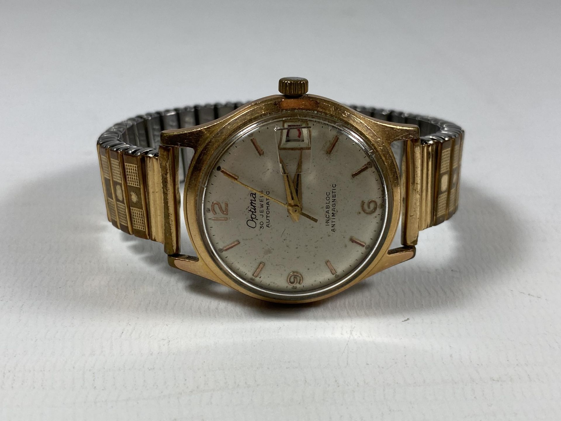 A VINTAGE 1960'S OPTIMA 30 JEWELS AUTOMATIC DATE WATCH