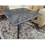 A SQUARE METAL GARDEN TABLE