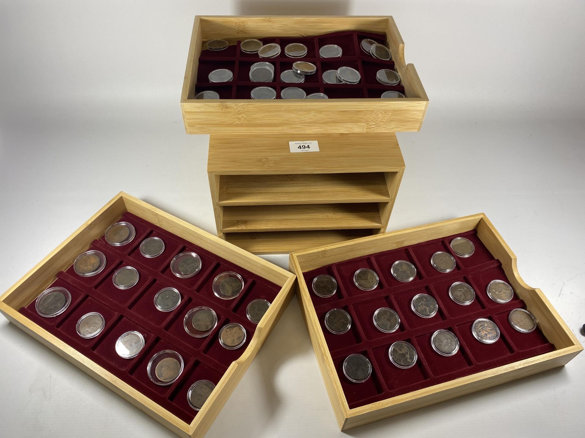 A 3 TIER COIN CABINET CONTAINING A RUN OF UK 1D COINS , STARTING WITH QV “YOUNG HEAD” , 1854 ,