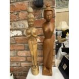 TWO HAND CARVED ORIENTAL STYLE FIGURES OF LADIES HEIGHT 64CM AND 67CM