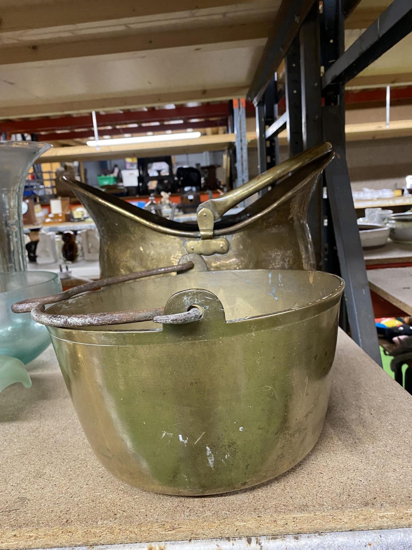 A LARGE BRASS COAL SCUTTLE AND A JAM PAN