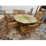AN OVAL TEAK GARDEN TABLE AND SIX FOLDING TEAK CHAIRS, TWO BEING CARVERS