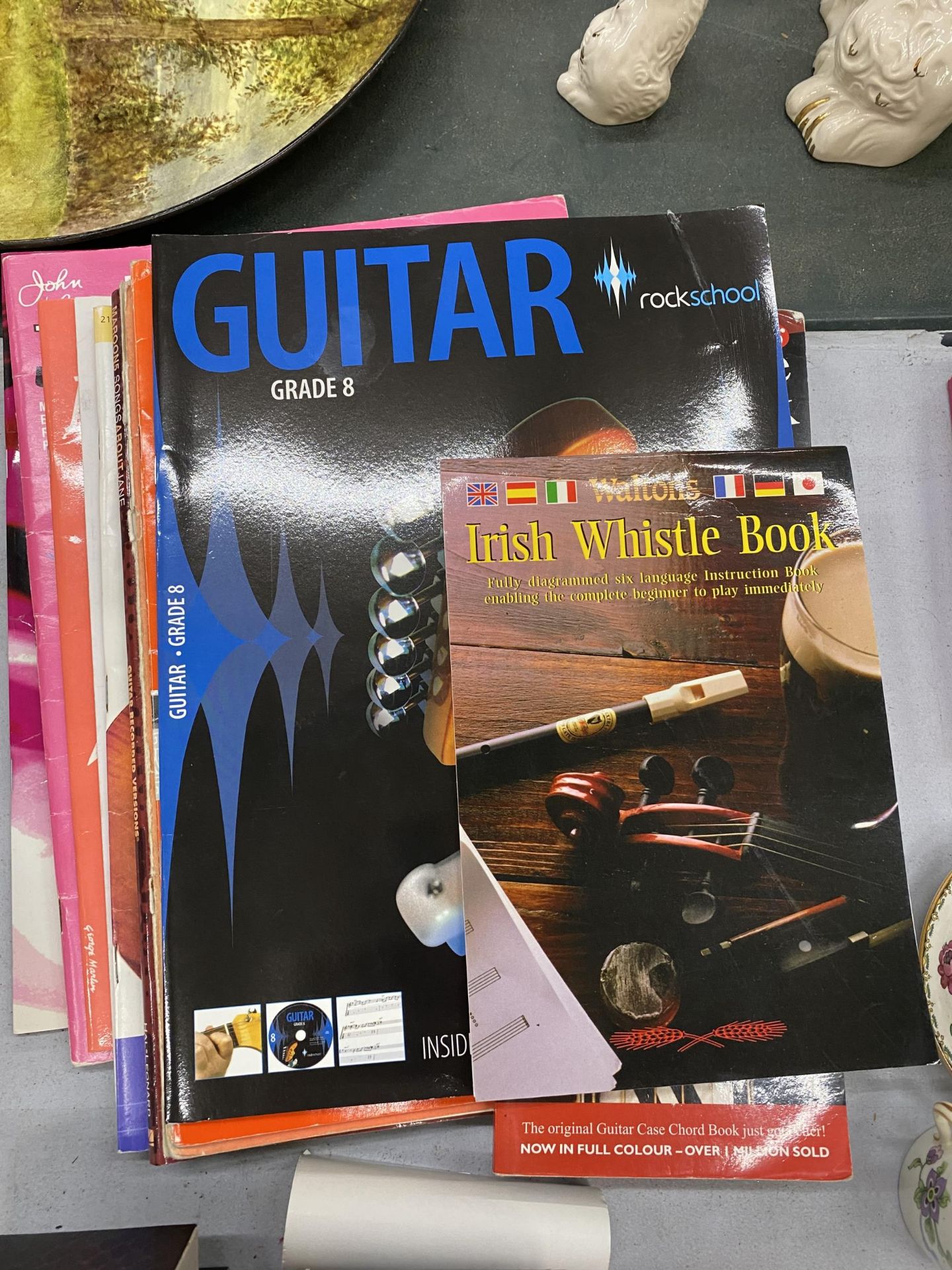 A QUANTITY OF MUSIC BOOKS MAINLY GUITAR AND PIANO