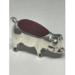 A MINIATURE SILVER PIG PIN CUSHION