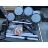 A PLAYSTATION DRUM KIT AND TWO GAMES TO INCLUDE GUITAR HERO WORLD TOUR