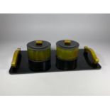 A 1950'S ART DECO STYLE BLACK & GREEN BAKELITE DRESSING TRAY WITH LIDDED POTS, 34 X 18CM