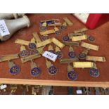 A COLLECTION OF BRASS BOLTON ROTARY CLUB BADGES