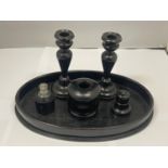 AN EBONY DRESSING TABLE SET TO INCLUDE A TRAY, CANDLESTICKS, PERFUME BOTTLE, ETC