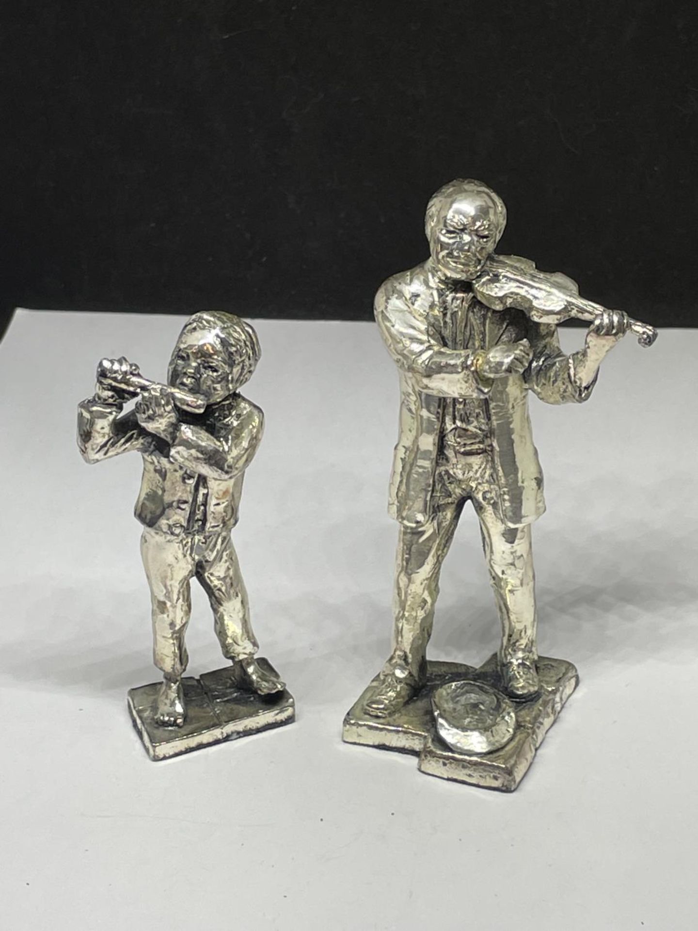 TWO SILVER PLATED MUSICIAN FIGURES