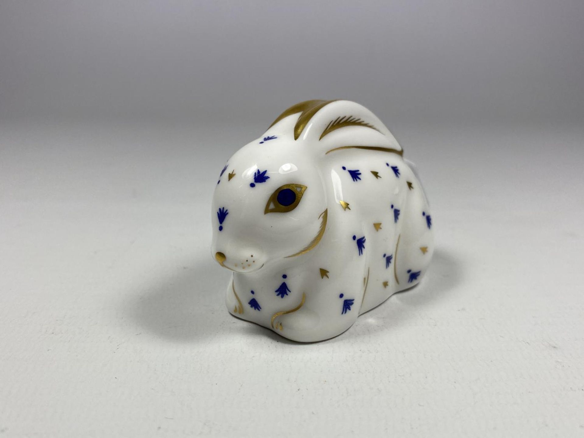 A ROYAL CROWN DERBY RABBIT WITH SILVER STOPPER
