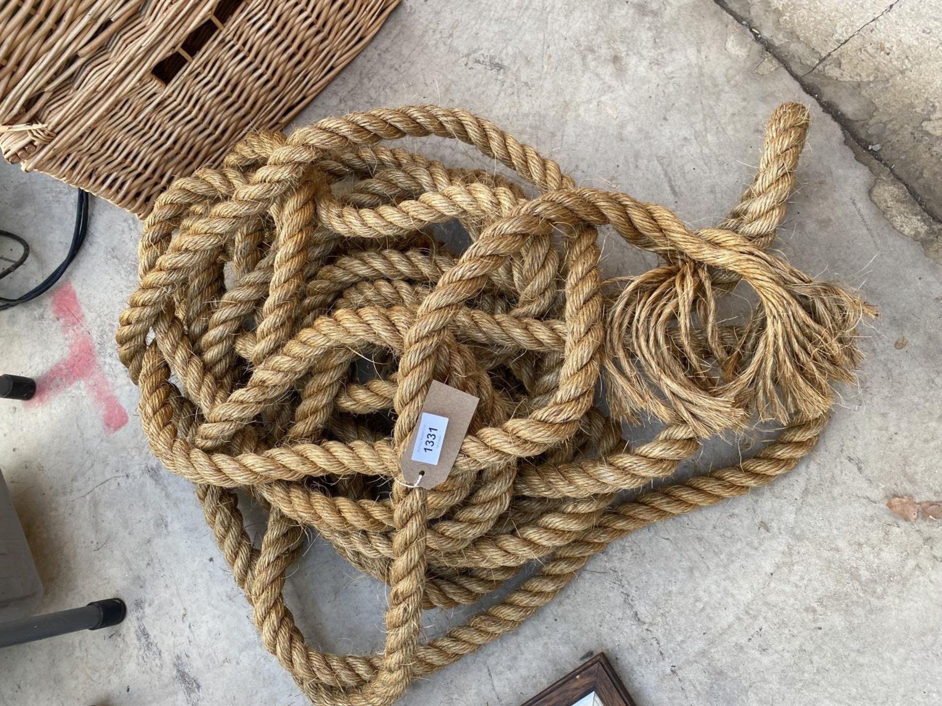 A LENGTH OF HEAVY DUTY HESSIAN ROPE