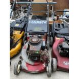 A PETROL ENGINE LAWN MOWER WITH GRASS BOX