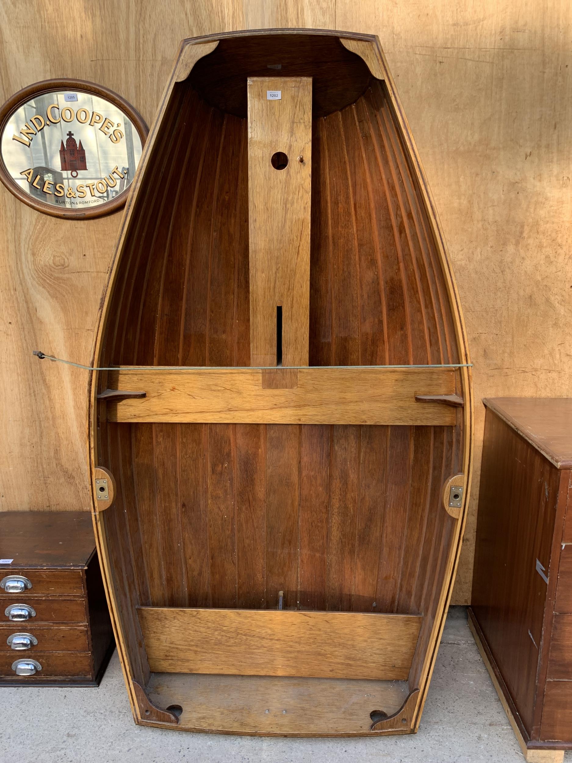 A VINTAGE HARD WOOD ROWING BOAT WITH INTERNAL SEATING (L:187CM W:107CM)