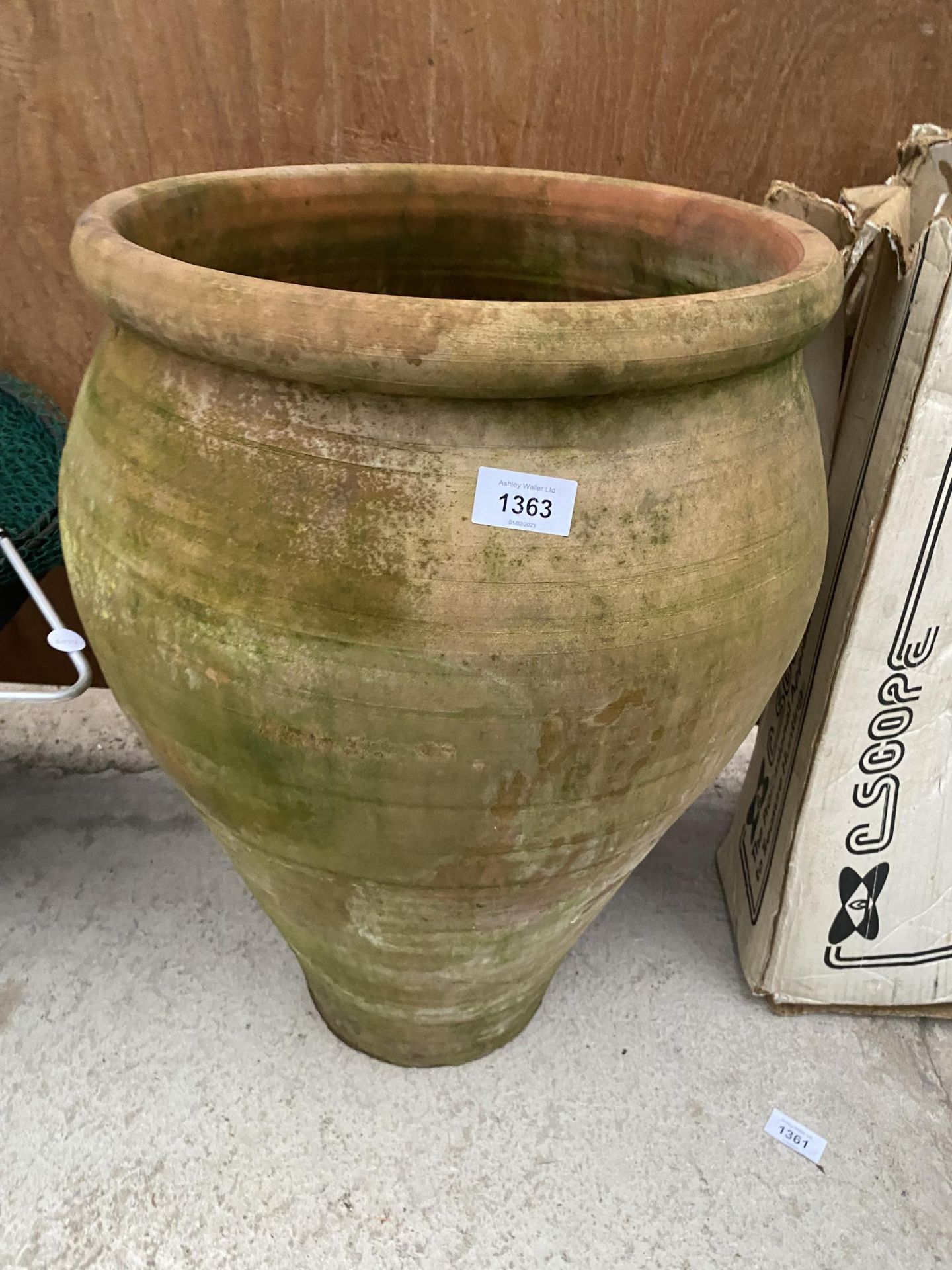 A LARGE TERRACOTTA POT