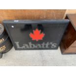 AN ILLUMINATED 'LABATT'S' SIGN