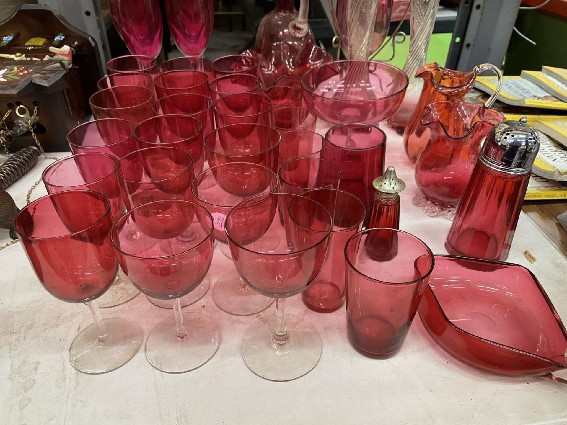 A LARGE QUANTITY OF CRANBERRY GLASS TO INCLUDE DRINKING GLASSES, VASES, JUGS, DECANTER, ETC., - Image 2 of 4